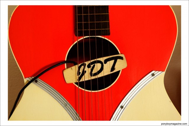 Close-up shot of musician Justin Dean Thomas' guitar. Photographed by Alexander Thompson for Ponyboy magazine.