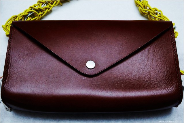 A detail shot of a men's brown bag designed by Devon Halfnight Leflufy, for Fall/Winter 2016. Photograph by Alexander Thompson for Ponyboy magazine.