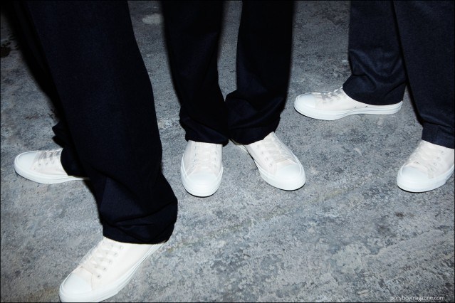 White converse tennis shoes photographed backstage at the Duckie Brown F/W16 menswear show. Photography by Alexander Thompson for Ponyboy magazine.