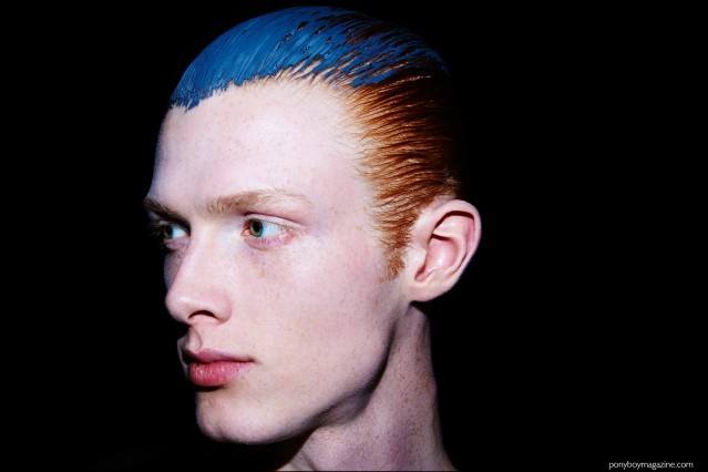 Model Linus Wordemann photographed with slicked back hair, backstage at Robert Geller F/W16 menswear show. Photography by Alexander Thompson for Ponyboy magazine.