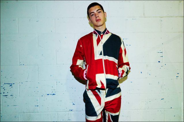 Male model Riley Dorland wears a Union Jack ensemble, backstage at the Libertine Spring/Summer 2017 show. Photography by Alexander Thompson for Ponyboy magazine.