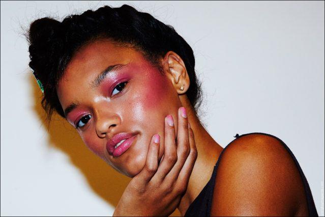 A model shows over her matching pink makeup and nails, backstage at the Adam Selman Spring/Summer 2017 show in New York City. Photographed by Alexander Thompson for Ponyboy magazine New York.