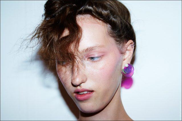 A close-up shot of a plastic disc earring designed by Adam Selman for Spring/Summer 2017. Photography by Alexander Thompson for Ponyboy magazine.