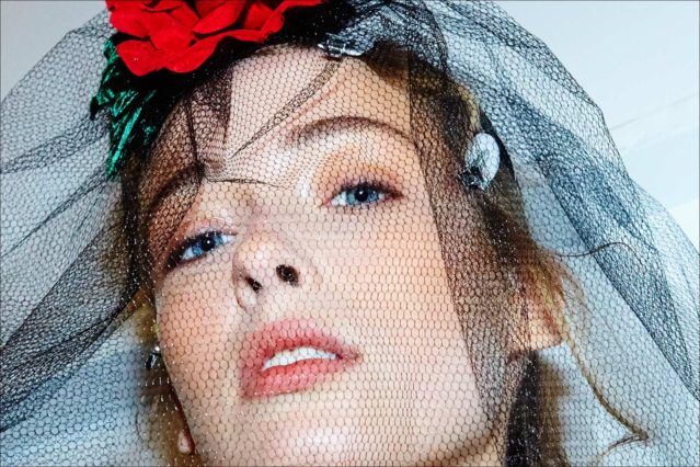 Close -up shot of a model in a mourning veil by Gigi Burris Millinery. Photographed by Alexander Thompson for Ponyboy magazine NY.