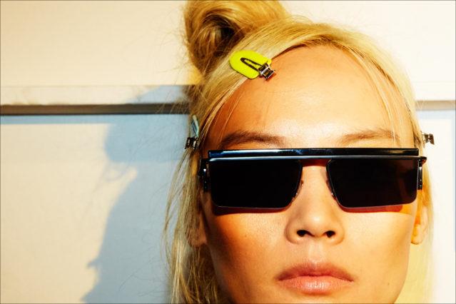 Modern sunglasses photographed backstage on a model at the Adam Selman Fall 2017 show. Photography by Alexander Thompson for Ponyboy magazine.