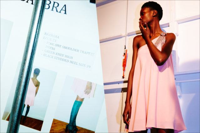 Model Barbra-Lee Grant in a pink trapeze dress, backstage at the Adam Selman Fall 2017 womenswear show. Photography by Alexander Thompson for Ponyboy magazine.