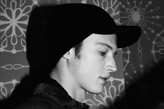Male model Abel Van Oeveren photographed backstage in a winter hat at the John Varvatos F/W17 menswear show. Photography by Alexander Thompson for Ponyboy magazine.