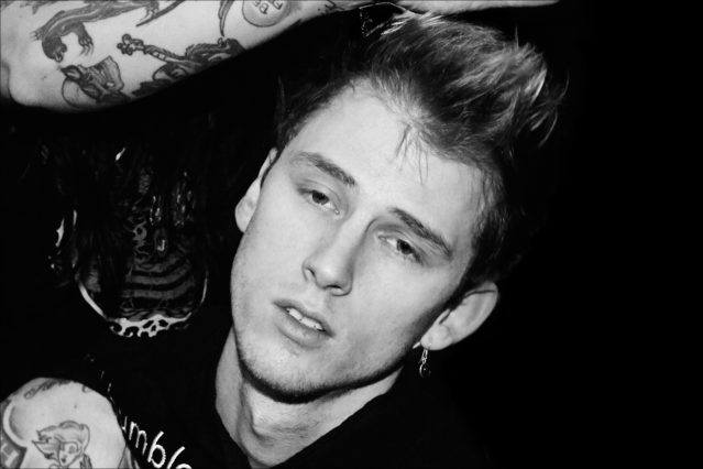 Musician Machine Gun Kelly photographed backstage in hair/makeup at the John Varvatos Fall/Winter 2017 menswear show. Photography by Alexander Thompson for Ponyboy magazine.