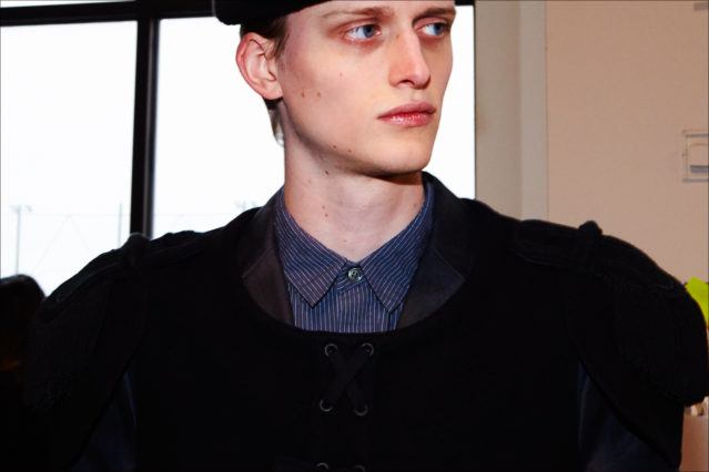 Model Alexander Newman wears an epaulet backstage at the Robert Geller A/W17 menswear show. Photographed in New York by Alexander Thompson for Ponyboy magazine.