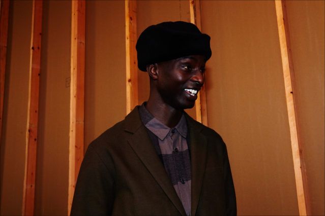 Model Aly N'Diaye snapped backstage at Robert Geller Autumn/Winter 2017 menswear collection. Photography by Alexander Thompson for Ponyboy magazine.