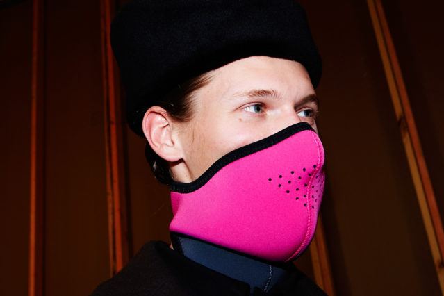 A model wears a pink ski mask, backstage at Robert Geller A/W17 menswear show. Photographed for Ponyboy magazine by Alexander Thompson.