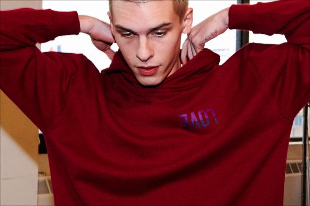Model August Gonet photographed backstage dressing at the Robert Geller A/W17 menswear show. Photography by Alexander Thompson for Ponyboy magazine.