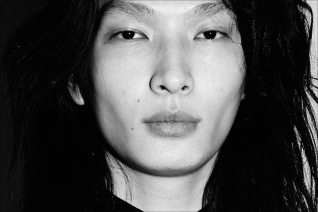 A close-up shot of model Zhengyang Zhang, backstage at the Carlos Campos F/W17 menswear show. Photographed by Alexander Thompson for Ponyboy magazine.