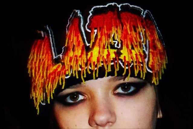 A model wears an embellished wool cap backstage at the Libertine F/W17 collection. Photographed by Alexander Thompson for Ponyboy magazine.