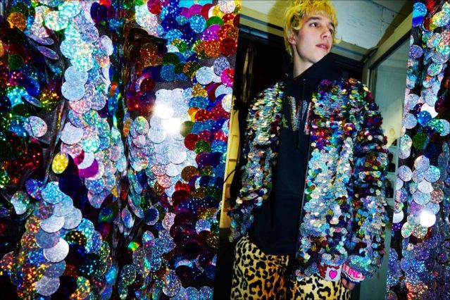 Male model Nick Hadad photographed backstage at Libertine F/W17 in holographic paillettes. Photography by Alexander Thompson for Ponyboy magazine.