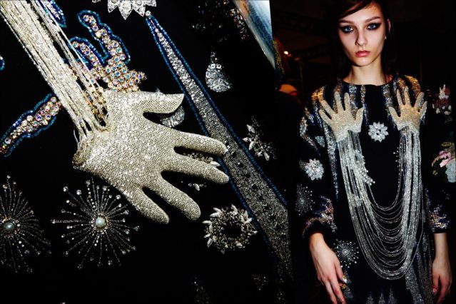 A model wears an embellished coat, backstage at the Libertine Fall/Winter 2017 collection. Photography by Alexander Thompson for Ponyboy magazine.