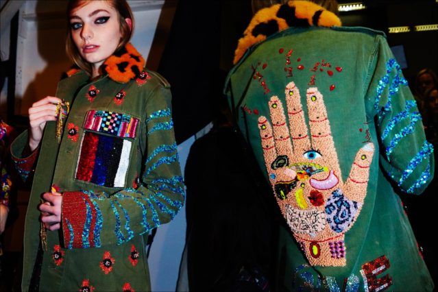 An elaborate jacket photographed on a model backstage at Libertine for Fall/Winter 2017. Photography by Alexander Thompson for Ponyboy magazine.