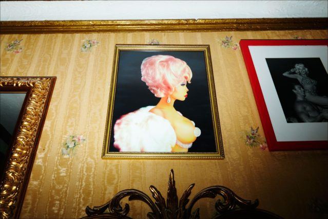 A Scott Ewalt painting of Amanda Lepore hangs in her New York City apartment. Photography by Alexander Thompson for Ponyboy magazine.