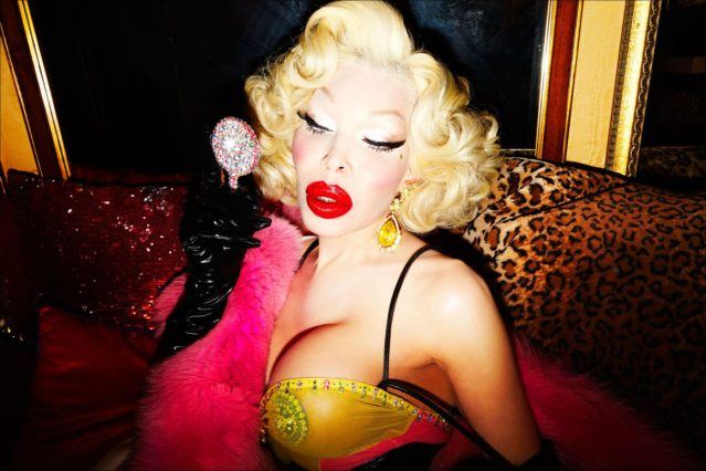 Model Amanda Lepore primps in the mirror in her apartment in New York City. Photographed by Alexander Thompson for Ponyboy magazine.