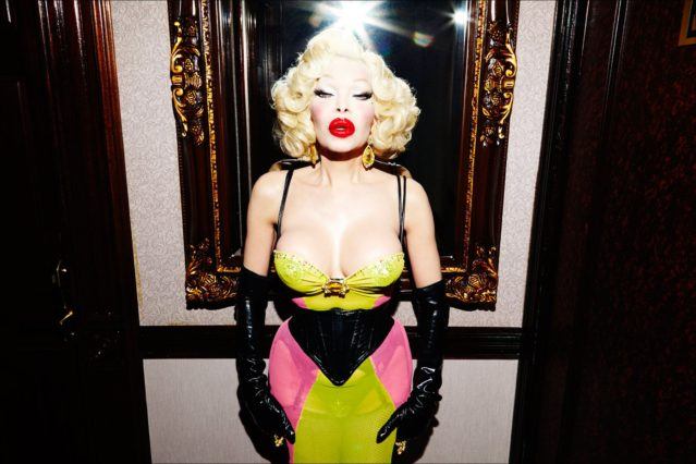 Model/entertainer Amanda Lepore photographed in front of a mirror in her New York City apartment. Photography by Alexander Thompson for Ponyboy magazine.
