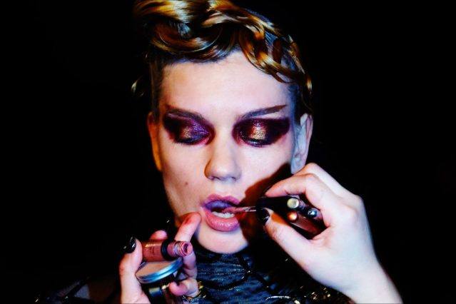 Model Lyoka Tyagnereva has her makeup retouched before walking for The Blonds Fall 2017 womenswear runway show. Photography by Alexander Thompson for Ponyboy magazine.