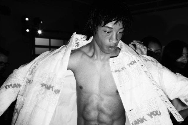 A model snapped backstage getting dressed by Alexander Thompson at Private Policy S/S18, for Ponyboy magazine.