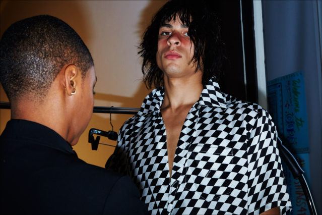 A model backstage in checkerboard, at Private Policy S/S18. Photography by Alexander Thompson for Ponyboy magazine.