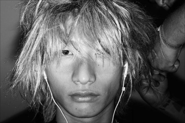 Model Sup Park snapped backstage in hair at Private Policy for Spring/Summer 2018. Photographed by Alexander Thompson for Ponyboy magazine.