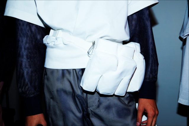 A fanny pack, backstage at the Feng Chen Wang menswear collection. S/S18. Photography by Alexander Thompson for Ponyboy magazine.