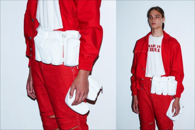 A male model wears a red look backstage at the Feng Chen Wang menswear show, S/S18. Photographs by Alexander Thompson for Ponyboy magazine.