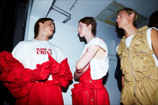 Models before walking backstage at Feng Chen Wang menswear. S/S18. Photography by Alexander Thompson for Ponyboy magazine.