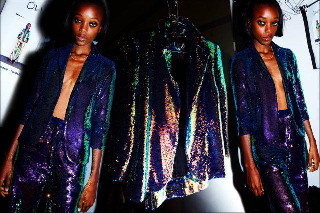 A model wears an iridescent sequin pantsuit from Libertine S/S18. Photographed by Alexander Thompson for Ponyboy magazine.