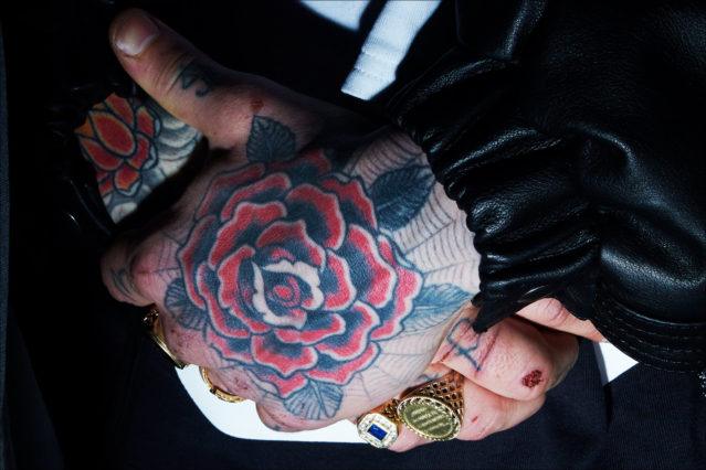 A models tattooed hand palm photographed backstage at the Willy Chavarria menswear show for Fall 2018. Photographed by Alexander Thompson for Ponyboy magazine.