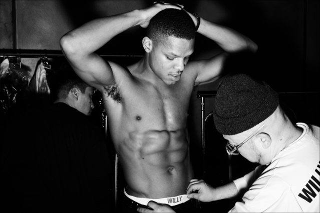 A bare chested model backstage at Willy Chaverria for Fall 2018. Photography by Alexander Thompson for Ponyboy magazine.