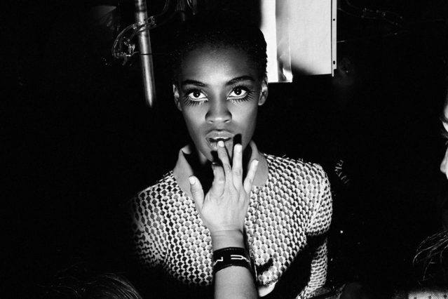 A model gets her lips applied backstage at the Christian Cowan womenswear show for Fall 2018. Photography by Alexander Thompson for Ponyboy magazine.
