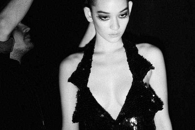 Spiky lashes with a halter sequin dress backstage at Christian Cowan for Fall 2018. Photographed by Alexander Thompson for Ponyboy magazine.