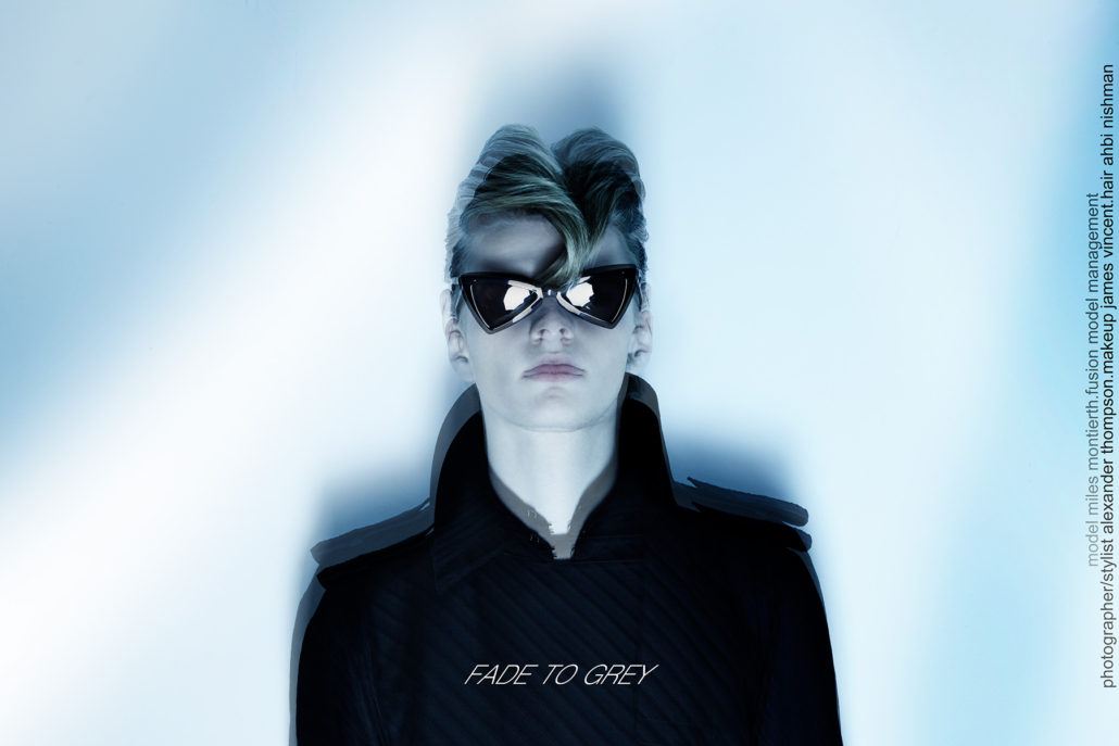 Model Miles Montierth wears a Saint Laurent sunglasses and a vintage Thierry Mugler Couture trenchcoat for Ponyboy menswear editorial, photographed by Alexander Thompson.