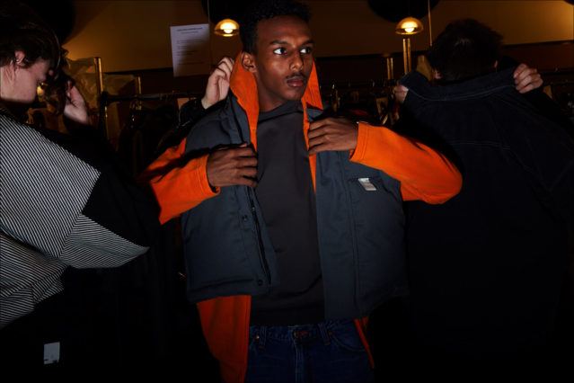 A model dressing at N. Hoolywood Fall 2018 menswear show. Photographed by Alexander Thompson for Ponyboy magazine.