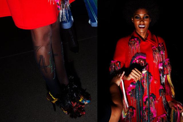 model wears a red custom coat backstage at Libertine for Fall 2018. Photography by Alexander Thompson for Ponyboy magazine.