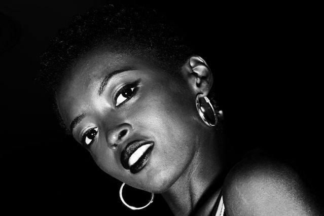 B&W photo of a model snapped backstage at Christian Cowan S/S19 show. Photography by Alexander Thompson for Ponyboy magazine.