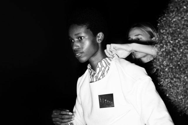 A model gets dressed backstage at the Linder Spring/Summer 2019 collection, photographed by Alexander Thompson for Ponyboy magazine.
