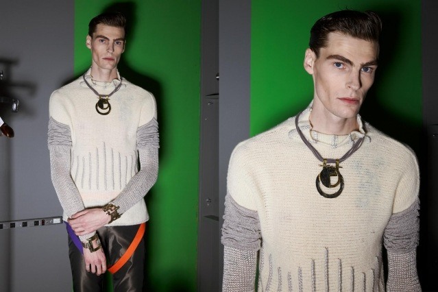 A male model photographed backstage in knitwear at the Fix & Fax show for Fall 2020 at Pier 59 Studios. Photography by Alexander Thompson for Ponyboy magazine.